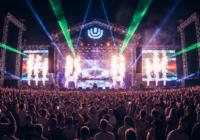 A photorealistic image of a massive electronic music festival stage at night, with vibrant laser lights, pyrotechnics, and a dense crowd of enthusiastic fans dancing, capturing the energetic atmospher
