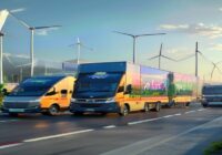 A fleet of electric delivery trucks and vans with PepsiCo branding driving on a clean, modern road in India, with solar panels and wind turbines in the background. Photorealistic, bright daylight, wid