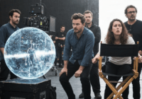 A photorealistic image showing a film set with a director's chair and a futuristic AI hologram displaying a scene, while traditional art directors look on with concern. No text or logos.