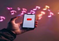 A hand holding a smartphone displaying the YouTube logo transforming into floating music notes, realistic lighting, modern minimal background